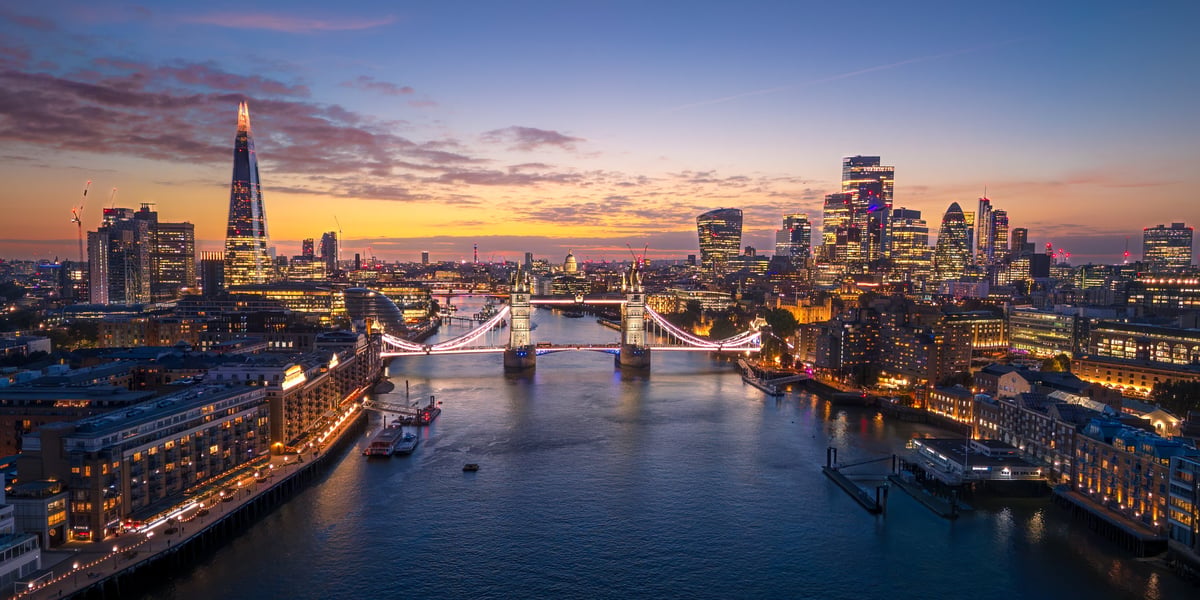 Global financial hub skyline at twilight, representing the international markets The Concierge serves